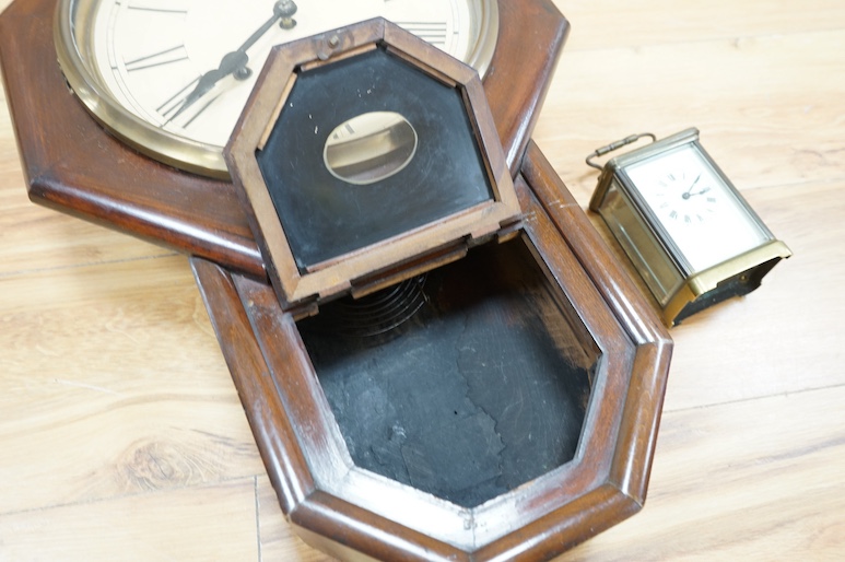 An American Seth Thomas mahogany wall clock and a French carriage timepiece, largest 55cm high. Condition - fair to good, untested